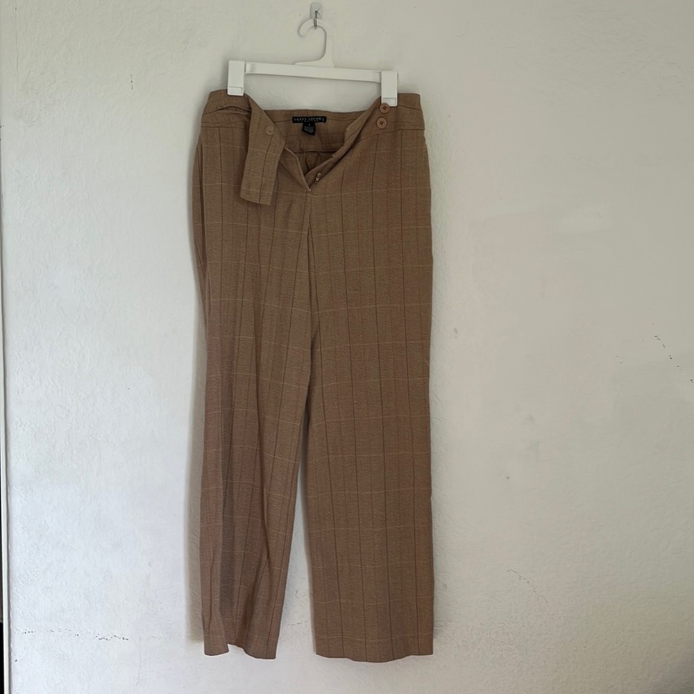Brown plaid women’s pants with front buttons.